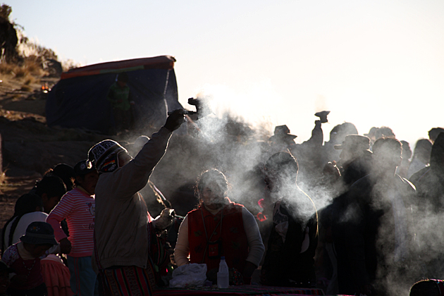 pilgrims in bolivia smoke offerings