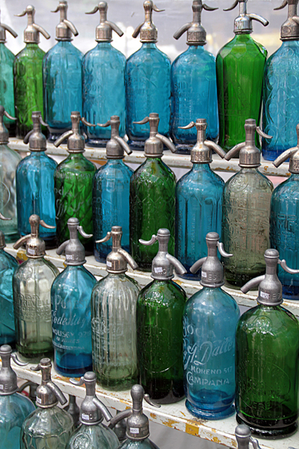 Vintage gas soda bottles in Buenos Aires in blue and green