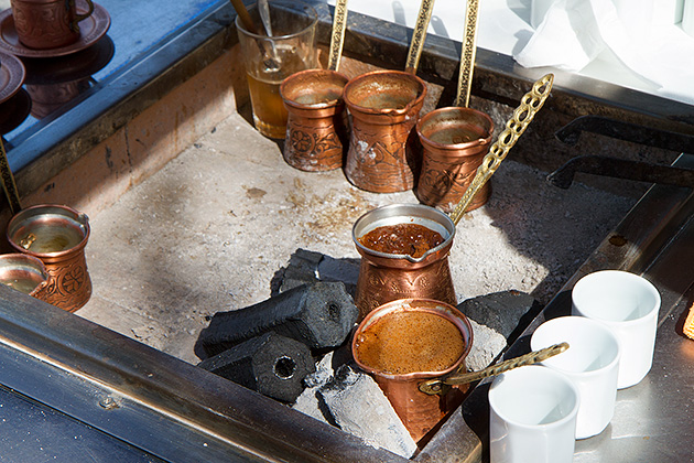 Boiling Turkish coffee in hot sand