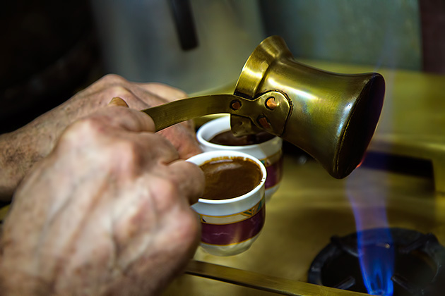 Pouring Turkish Coffee into small cups