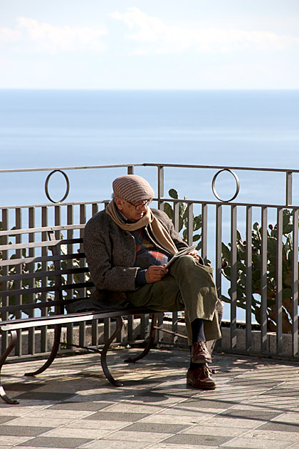 Taormina reading a book