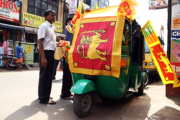 Tuk Tuk covered in Sri Lanka falgs