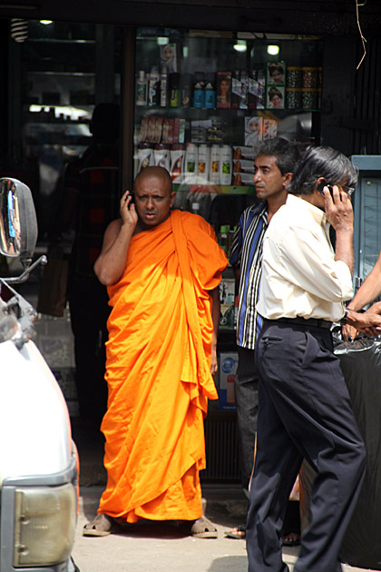 Buddhist monk on mobile phone