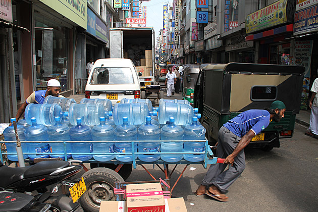 Pulling water bottles in Colombo Sri Lanka