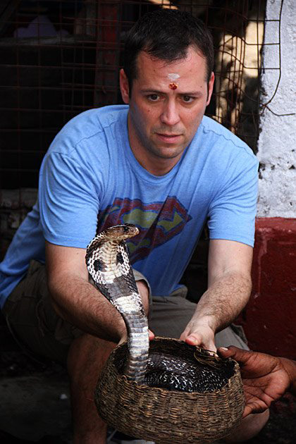 Man holding cobra - most deadly snakes of Sri Lanka