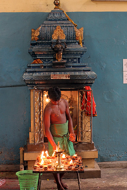 Lighting oil lamps at a kovil