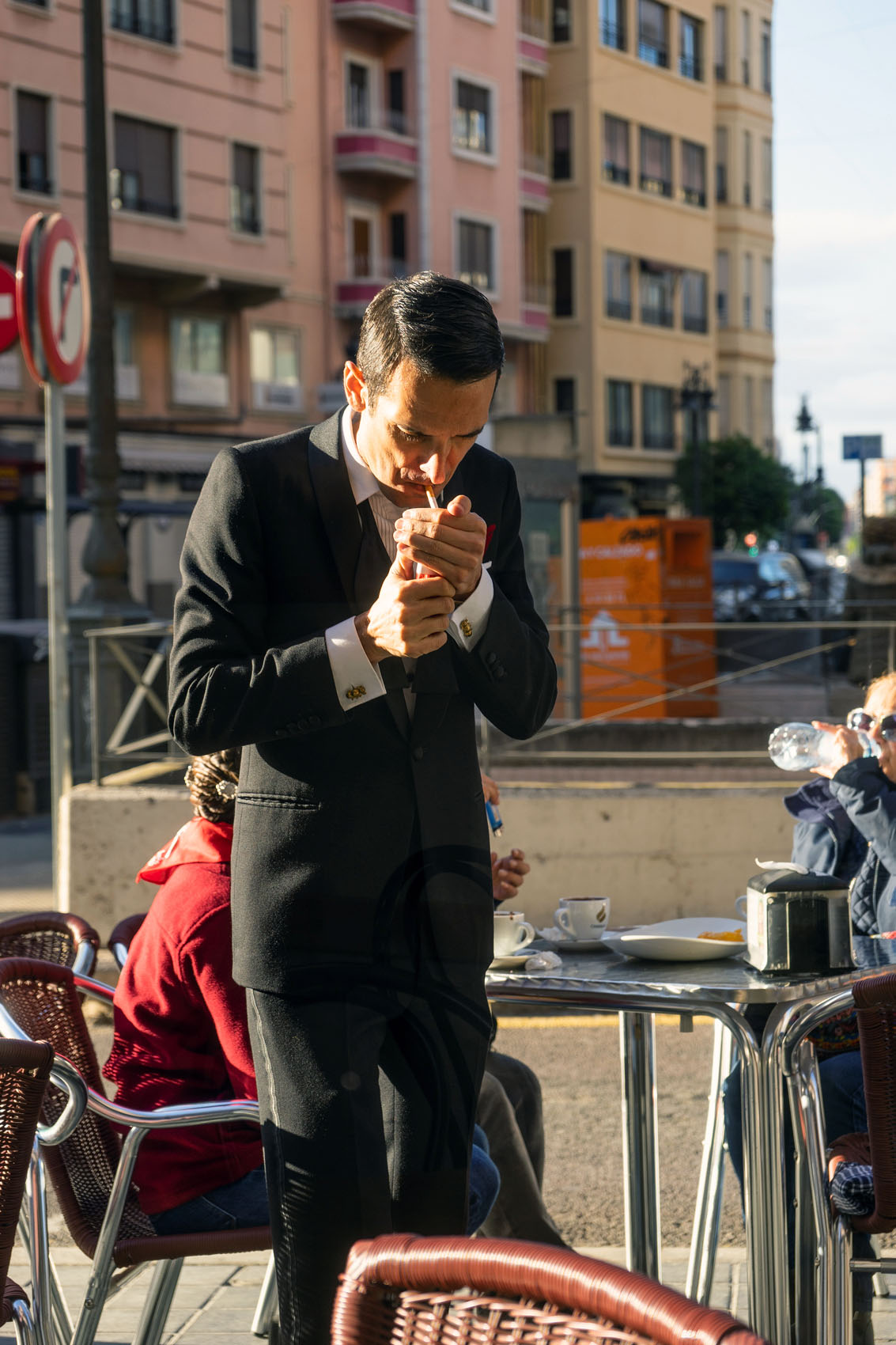 Man in Suit Lighting Cigarette