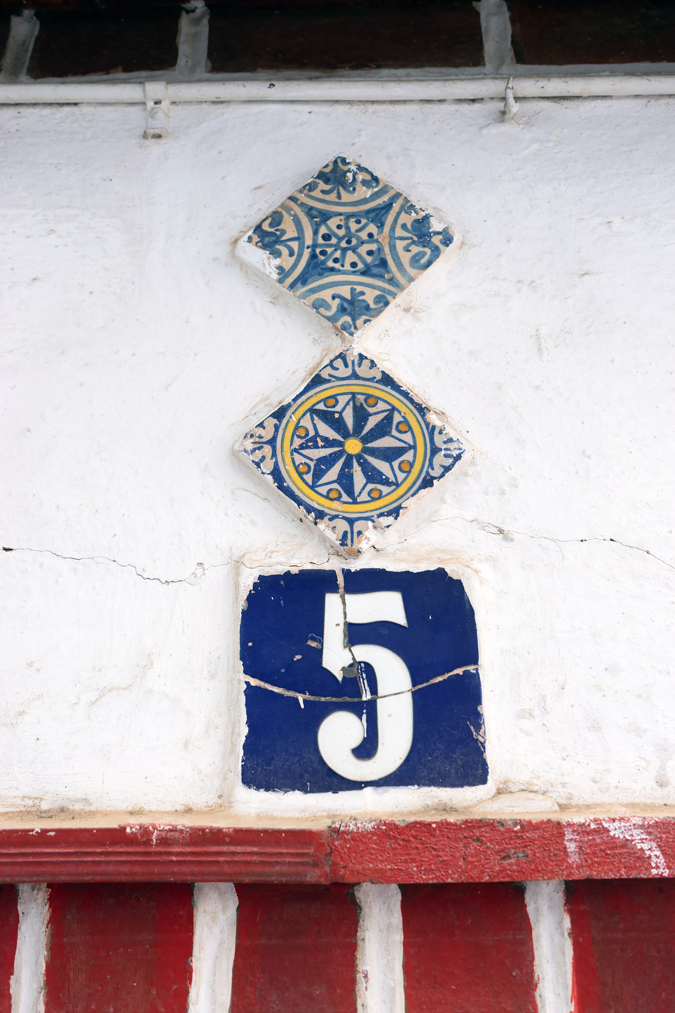 The number 5 house sign with tiles