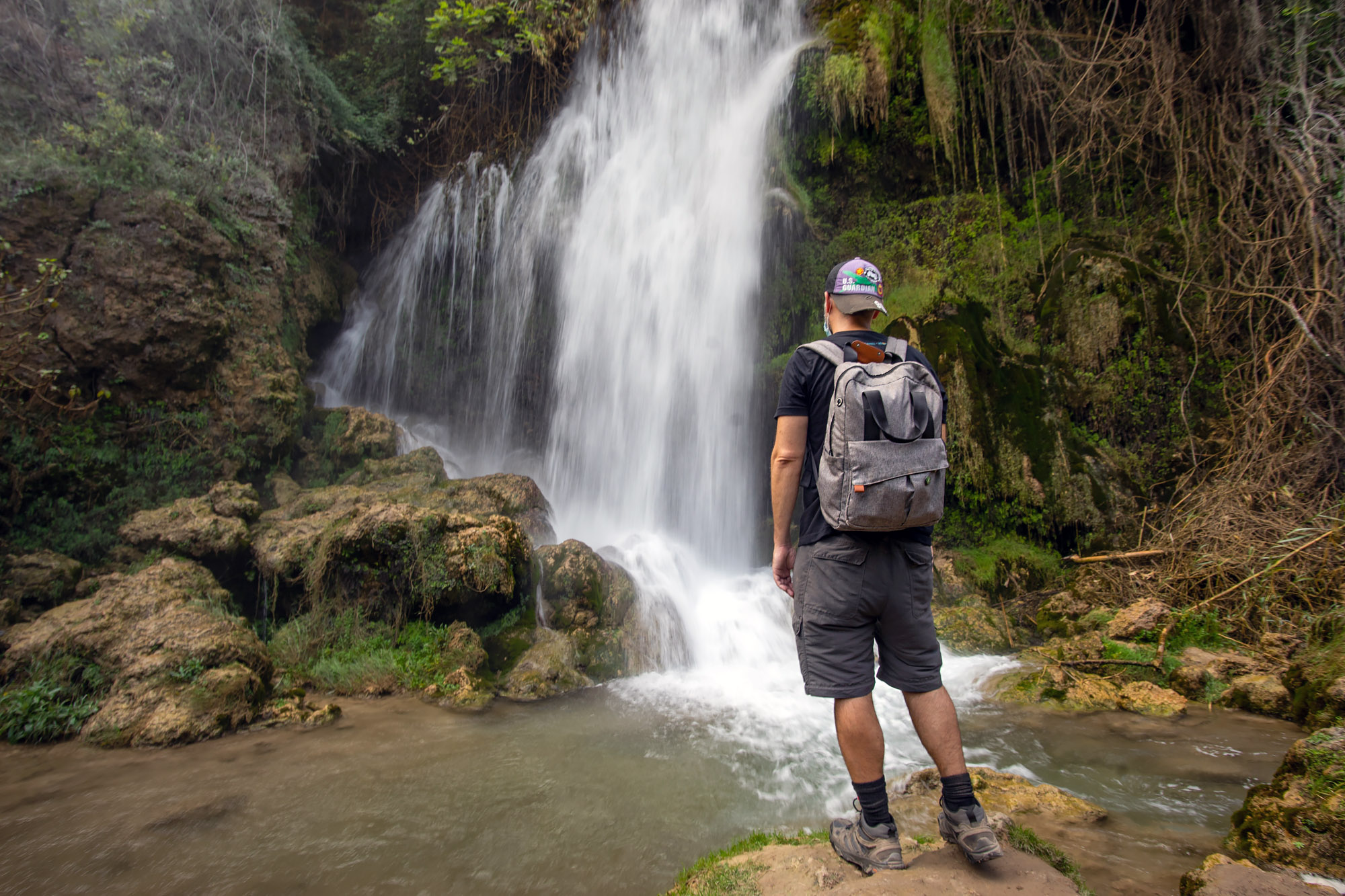 Travel Blogger and waterfall