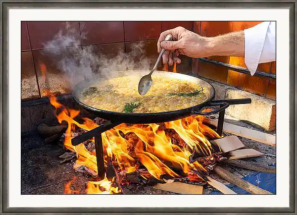 Framed photo of paella cooking