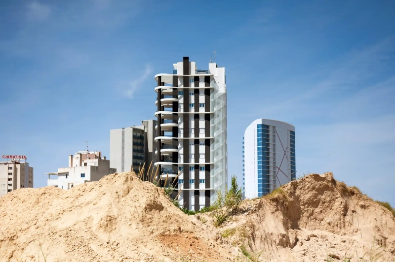 Sand pile and skyscrapers