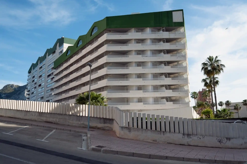 Green and white building in Calpe